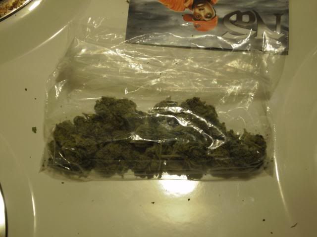 ounce of weed in bag. Balloon canister of oz lower